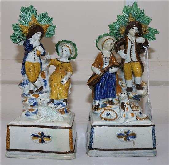 A pair of Pratt-type pearlware groups, c.1810, 21.5cm and 21cm, some high quality restoration